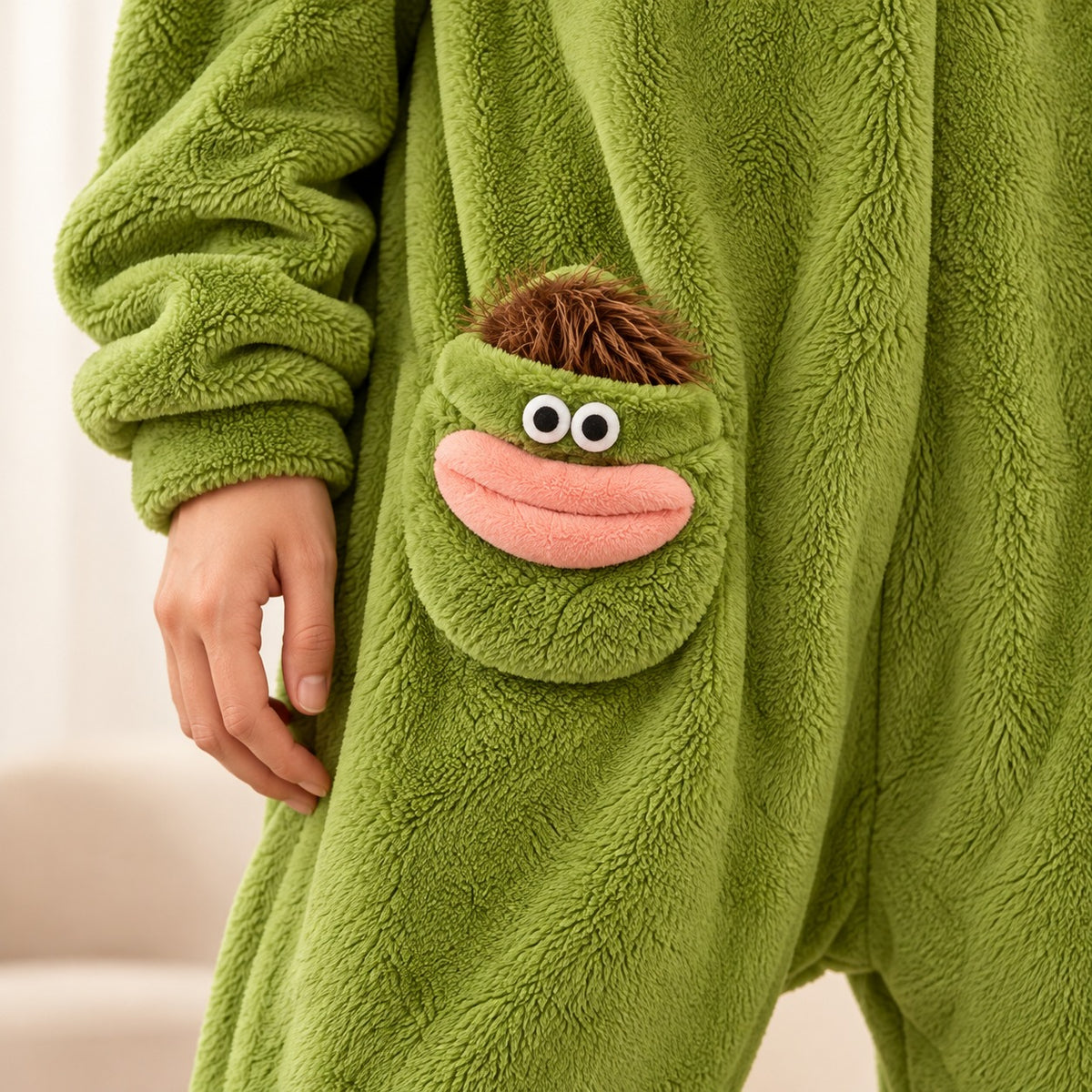 Monster onesie green pocket detail
